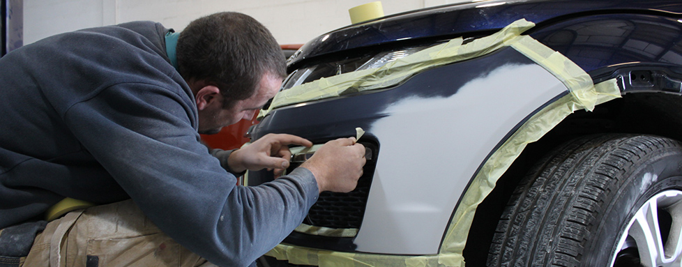 Image of a man carrying out an MOT for Peterborough garage FRM Automotive