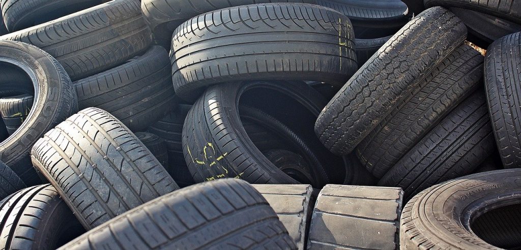 Image of a pile of old car tyres