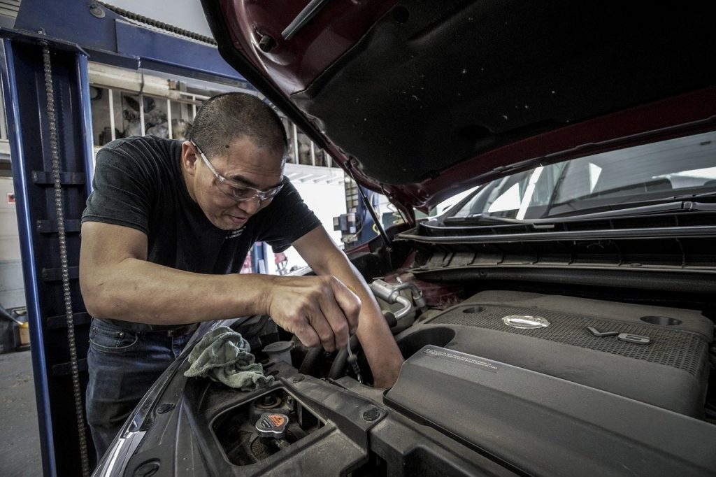 Mechanic working on car