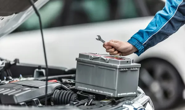 worker working on a battery.